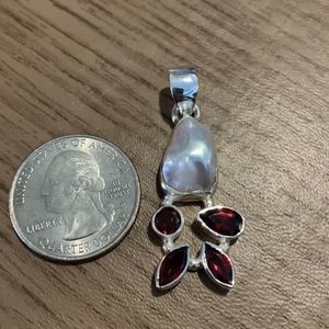 Beautiful expensive looking pendant with simulated pearl and Garnet stones